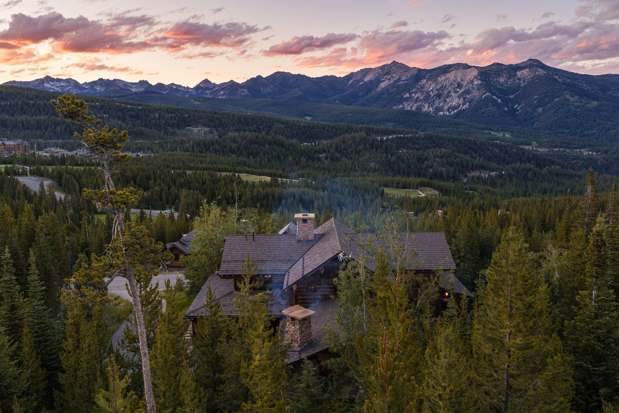 Aerial sunset over the surrounding peaks — architectural photography Big Sky Montana, Club Ridge